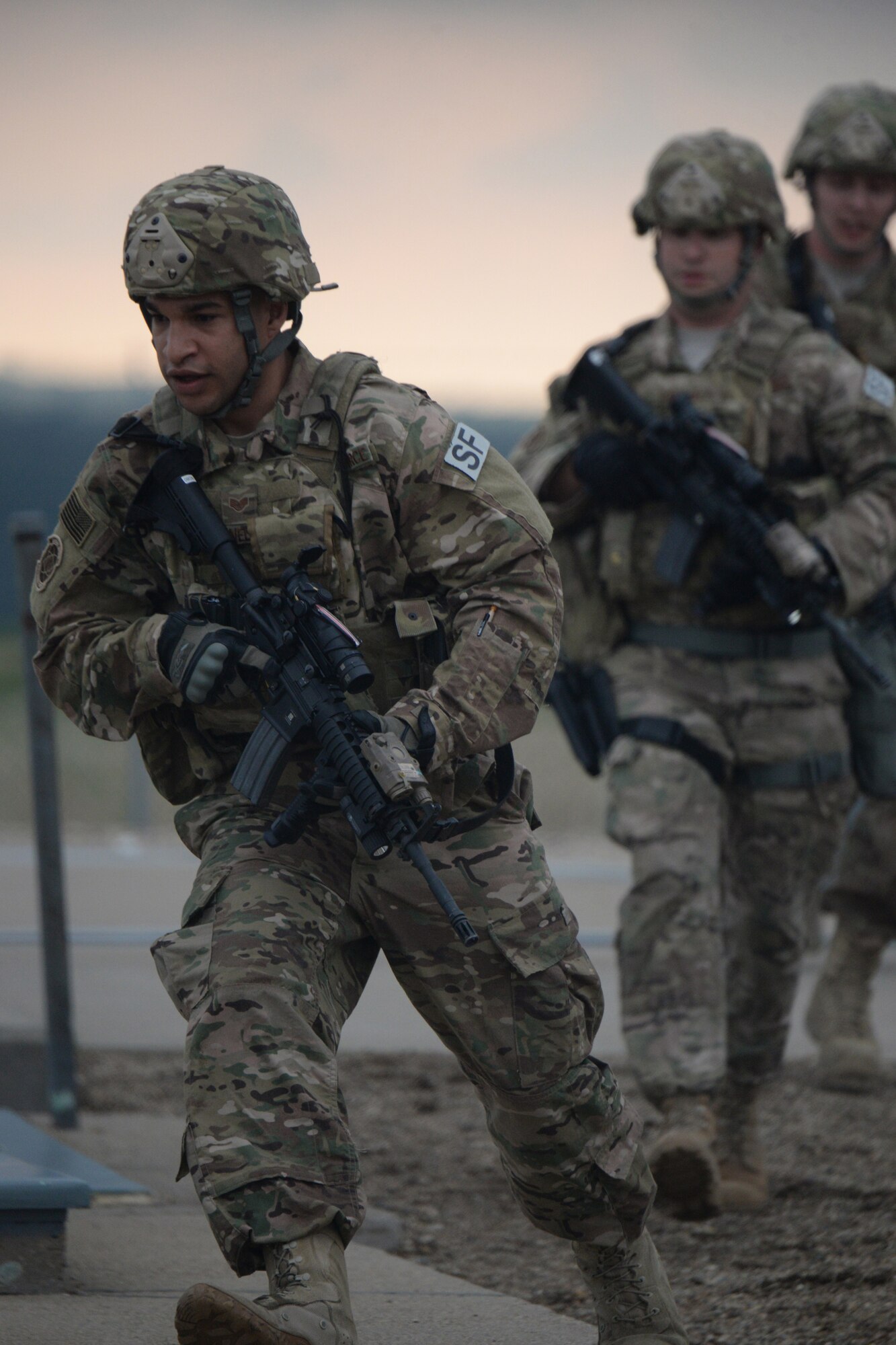 Staff Sgt. Joseph Burnelle, of the 219th Security Forces Squadron, left, runs into position with his fellow Airmen during a training exercise requiring the recapture of a launch facility after a simulated hostile take-over of the facility in the Minot Air Force Base Missile Field Complex, near Minot, North Dakota, May 25, 2016. He is one of the North Dakota Air National Guard members who took primary positions for missile filed security in an entire ‘sector’ of the missile field complex during a two week period from May 23 through June 4. This is the fourth time such an annual training surge has happened with the 219th SFS in the complex, which covers 8,500 square miles over the North Dakota plains near Minot and includes dozens of missile field alert facilities and missile launch facilities. (U.S. Air National Guard Photo by Senior Master Sgt. David H. Lipp/Released)