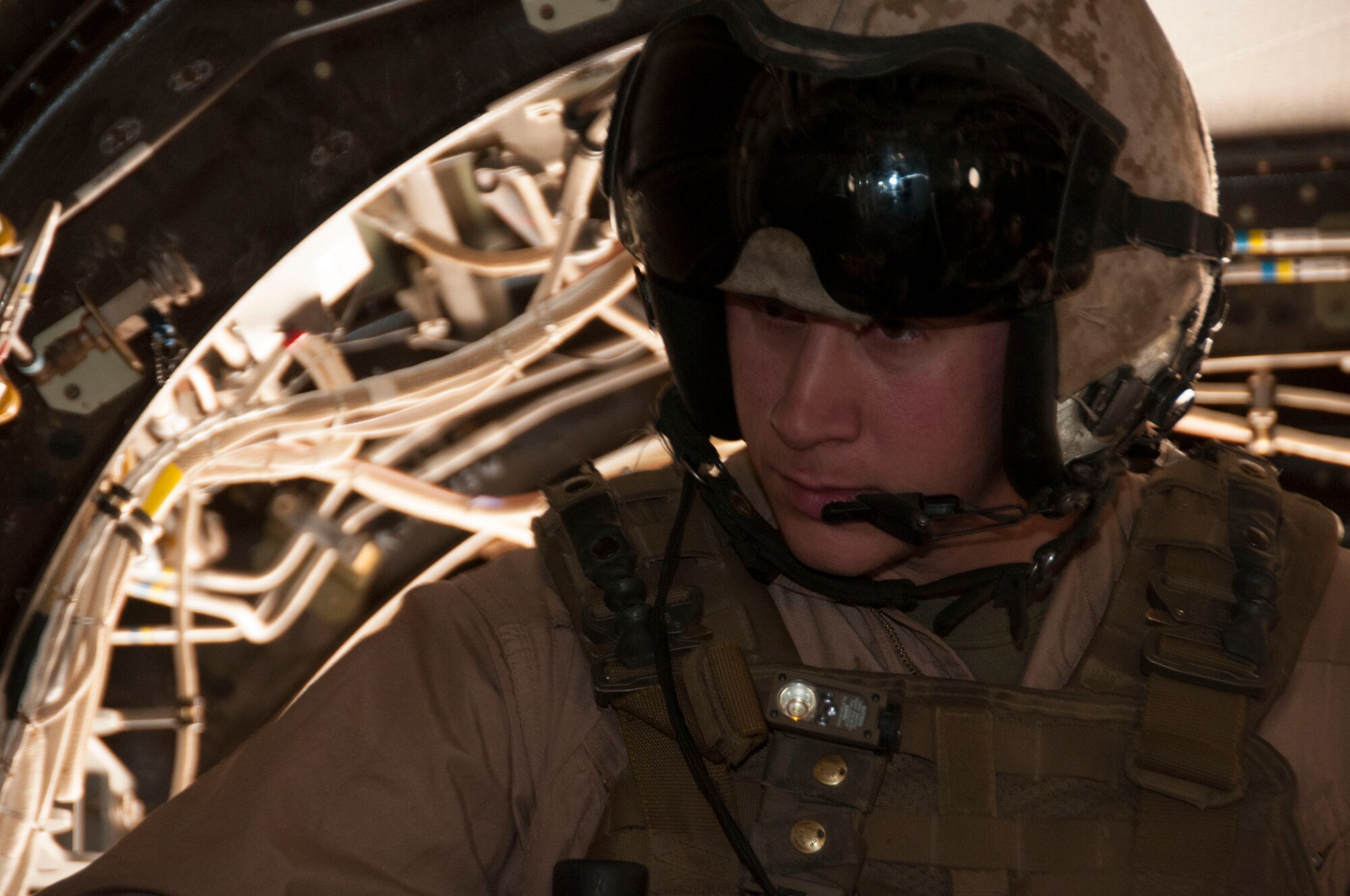 Marine Corps Sgt. Derek Levi conducts pre-flight checks in a MV-22 Osprey, May 20. Levi is a crew chief with the Marine Medium Tiltrotor Squadron - 165, a Miramar, California, unit that brought their MV-22 Ospreys to the 162nd Wing’s Total Force Training Center, located at Davis-Monthan Air Force. (U.S. Air National Guard photo by Tech. Sgt. Erich B. Smith)