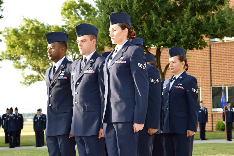 Airmen hold reveille in the sunrise during Airman leadership school at the Chief Master Sergeant Paul H. Lankford Enlisted Professional Military Education Center, June 16, 2016, on McGhee Tyson Air National Guard Base in Louisville, Tenn. (U.S. Air National Guard photo by Master Sgt. Mike R. Smith/Released)