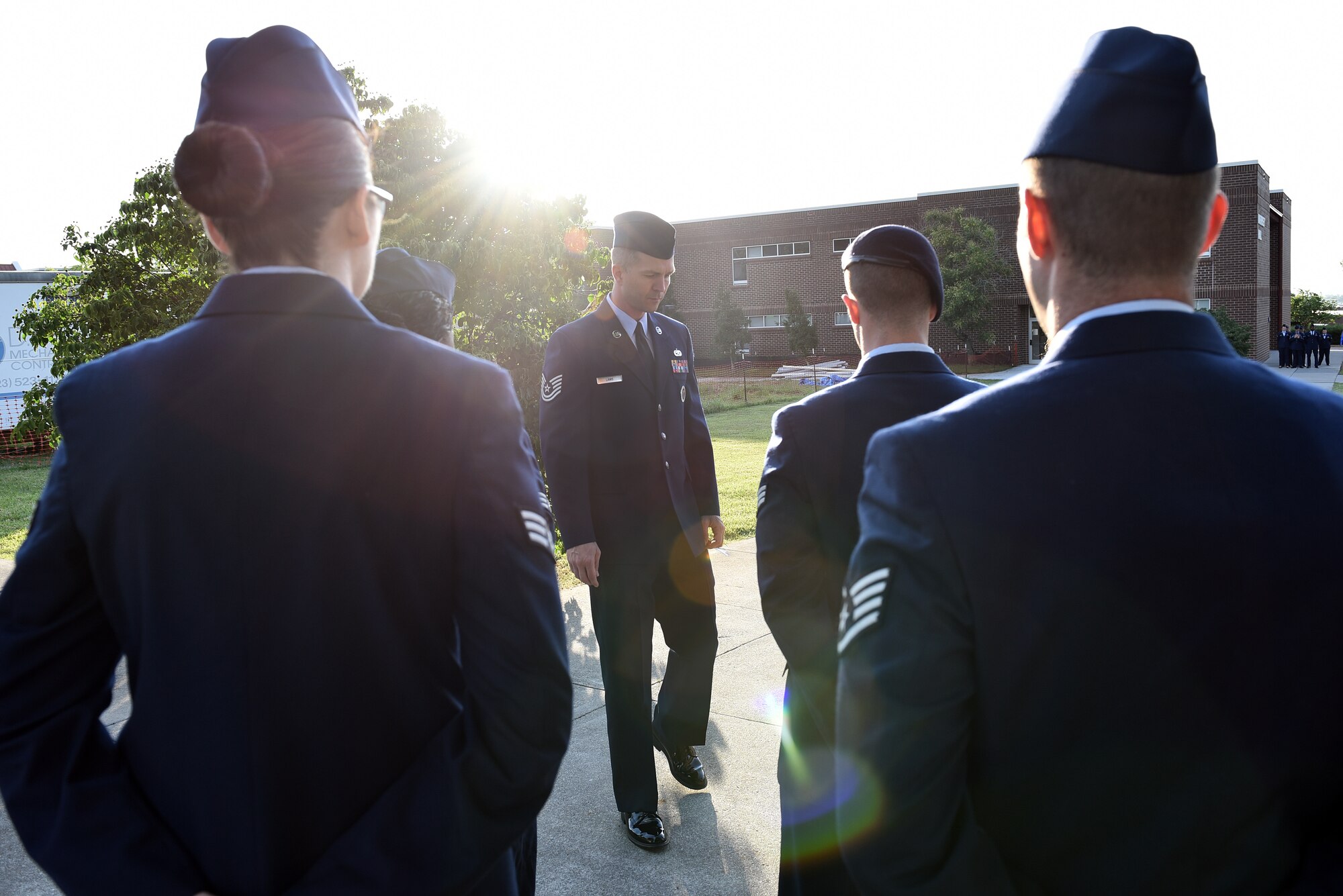 Airmen hold reveille in the sunrise during Airman leadership school at the Chief Master Sergeant Paul H. Lankford Enlisted Professional Military Education Center, June 16, 2016, on McGhee Tyson Air National Guard Base in Louisville, Tenn. (U.S. Air National Guard photo by Master Sgt. Mike R. Smith/Released)