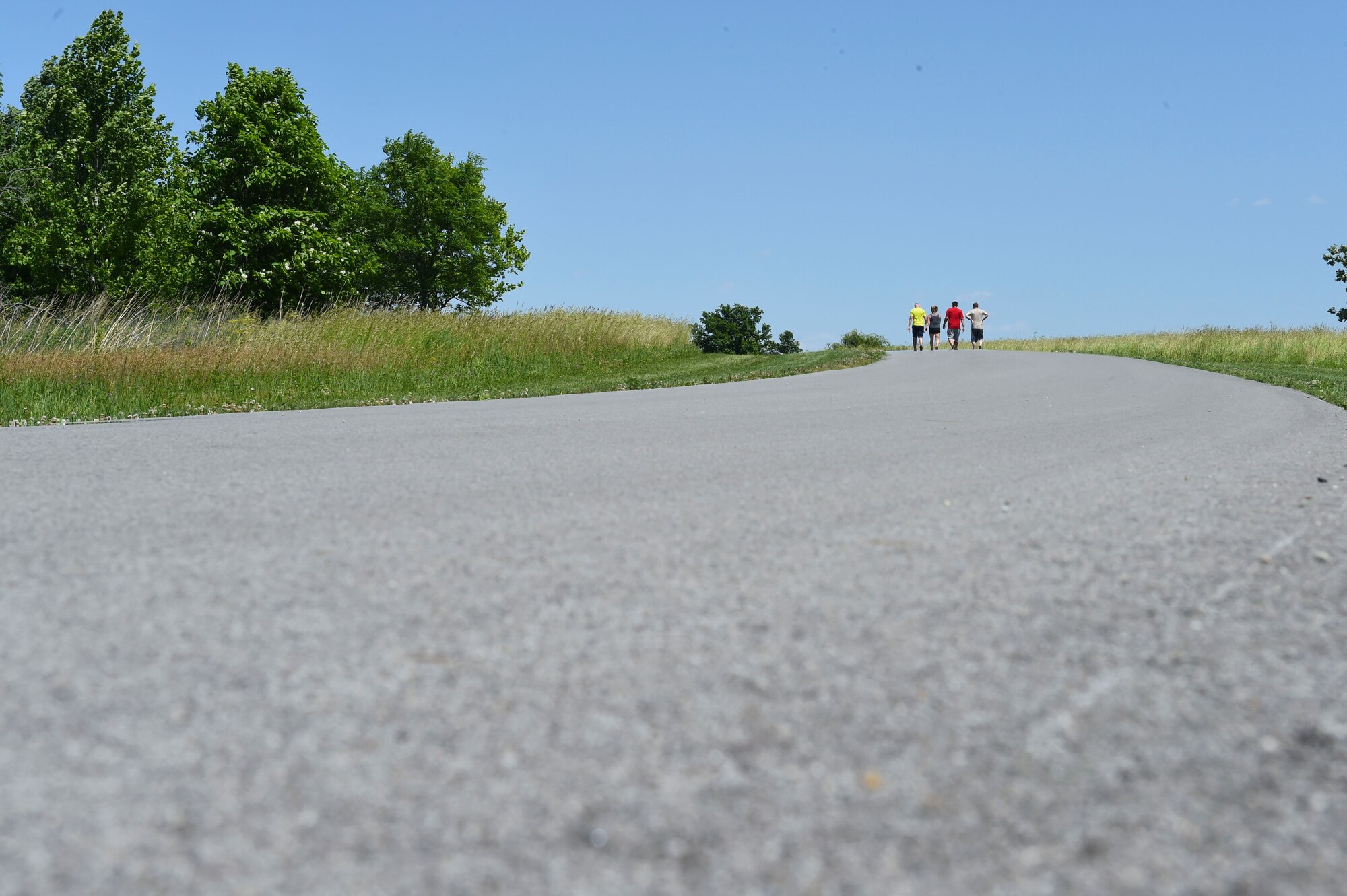 132nd Intelligence Surveillance and Reconnaissance Group members finish the last stretch of the race, June 6, 2016, at Moffitt Resevoir Park in Cumming, Iowa. The ISRG held an amazing race event to kickstart Annual Training Week. (U.S. Air National Guard photo by Staff Sgt. Michael J. Kelly/Released)