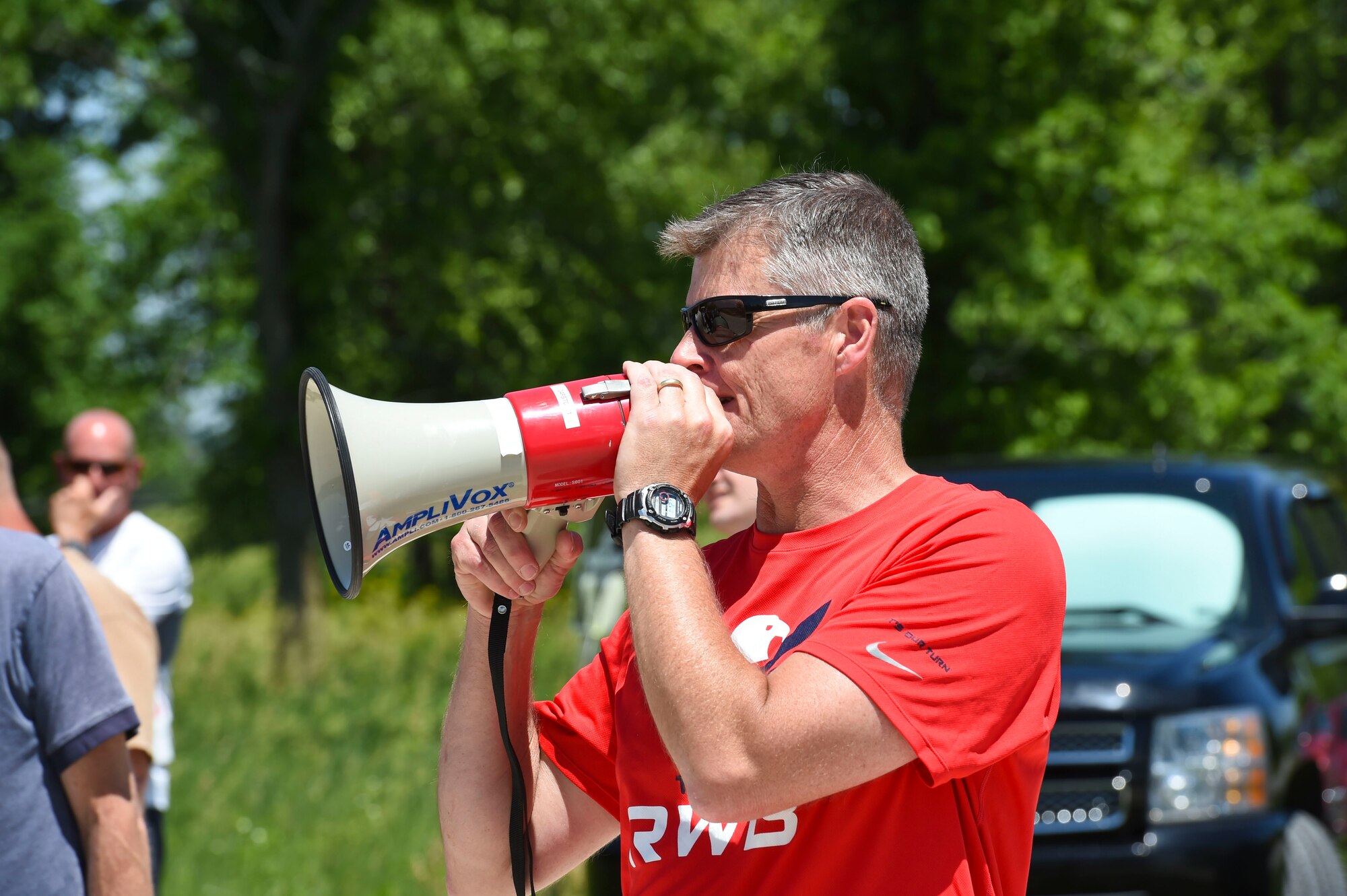 Chief Master Sgt. James Holwegner, the 132nd Intelligence Surveillance and Reconnaissance Group superintendent, shouts instructions June 6, 2016, at Moffitt Resevoir Park in Cumming, Iowa. The ISRG held an amazing race event to kickstart Annual Training Week. (U.S. Air National Guard photo by Staff Sgt. Michael J. Kelly/Released)