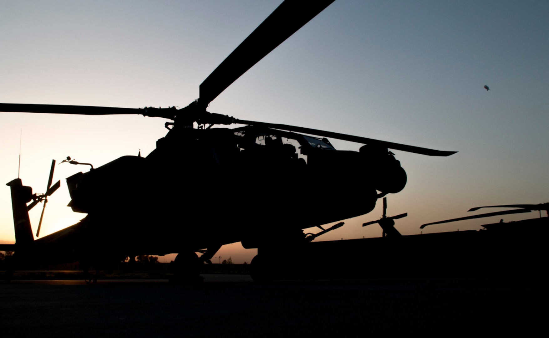 A 40th Combat Aviation Brigade Apache sits on the flightline at Forward Operating Base Fenty, Afghanistan. (Army photo by Staff Sgt.  Ian M. Kummer)