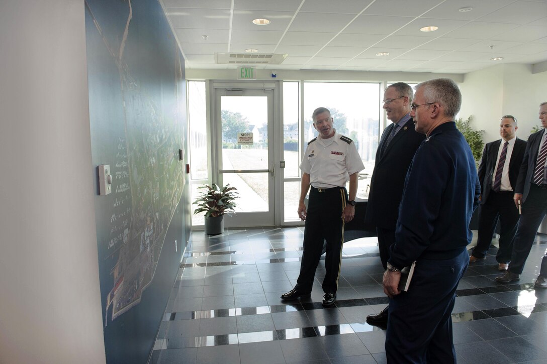 Deputy Defense Secretary Bob Work, center right, and Air Force Gen. Paul J. Selva, vice chairman of the Joint Chiefs of Staff, right, look at a map of the base with Army Gen. David Perkins, left, commander, U.S. Army Training and Doctrine Command, at Fort Eustis, Va., June 16, 2016. DoD photo by Navy Petty Officer 1st Class Tim D. Godbee