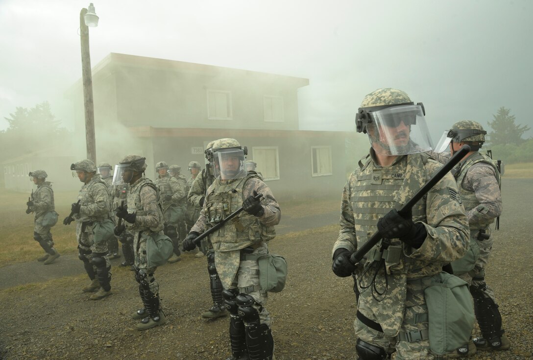 Security forces members from the Oregon Air National Guard’s 142nd and 173rd fighter wings train together during a door-to-door search at a training village in Warrenton, Ore., during exercise Cascadia Rising on June, 10, 2016. The exercise scenario was a 9.0 magnitude earthquake along the Cascadia Subduction Zone, which resulted in a tsunami, testing first responders, emergency management and public safety officials in the Pacific Northwest. (U.S. Air National Guard photo/Tech. Sgt. John Hughel)