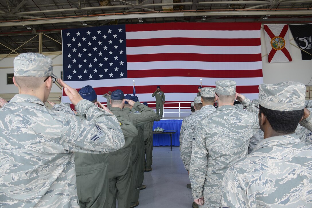 The Airmen of the 367th Fighter Squadron render their last salute to Lt. Col. Henry Jeffress as their commander during a change-of-command ceremony inside Hangar 200 at Homestead Air Reserve Base, Fla. Jeffress served as commander of the 367th FS for two years. (U.S. Air Force photo/Senior Airman Frank Casciotta)