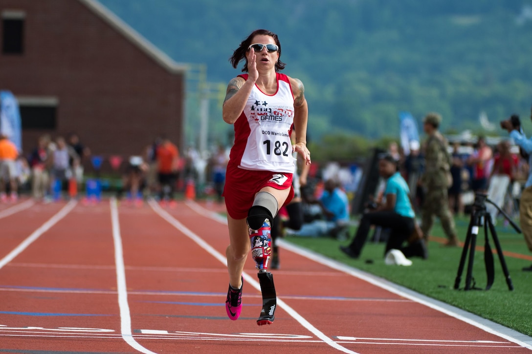 Marine Corps veteran Sarah Rudder finishes first in a 100-meter dash competition during the 2016 Department of Defense Warrior Games at the U.S. Military Academy in West Point, N.Y., June 16, 2016. DoD photo by EJ Hersom