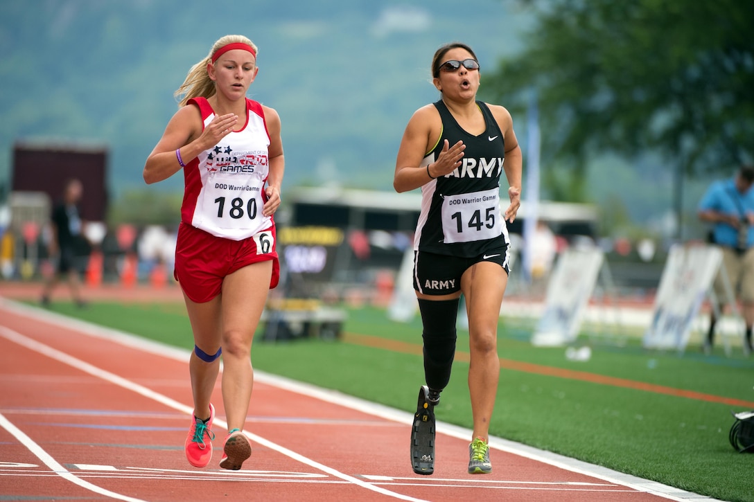 Marine Corps veteran Rose Jessica Hammack, left, and Army veteran Ana Manciaz race during the 2016 Department of Defense Warrior Games at the U.S. Military Academy in West Point, N.Y., June 16, 2016. DoD photo by EJ Hersom