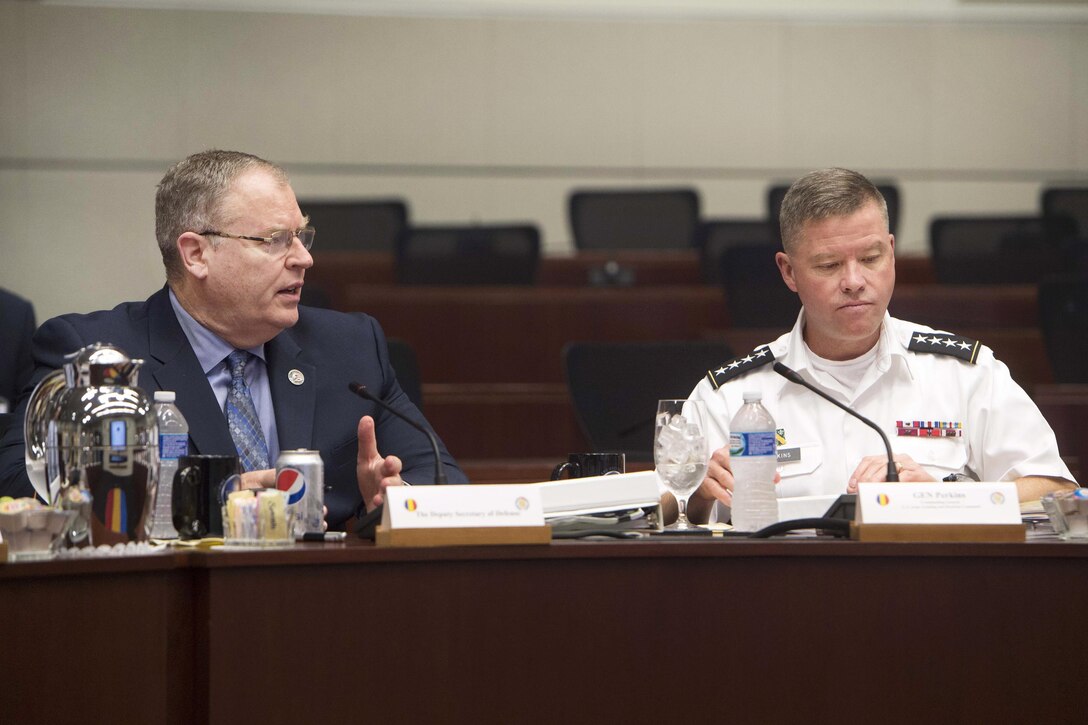 Deputy Defense Secretary Bob Work, left, and Army Gen. David Perkins, commander, U.S. Army Training and Doctrine Command, meet with senior flag officers at Fort Eustis, Va., June 16, 2016. DoD photo by Navy Petty Officer 1st Class Tim D. Godbee