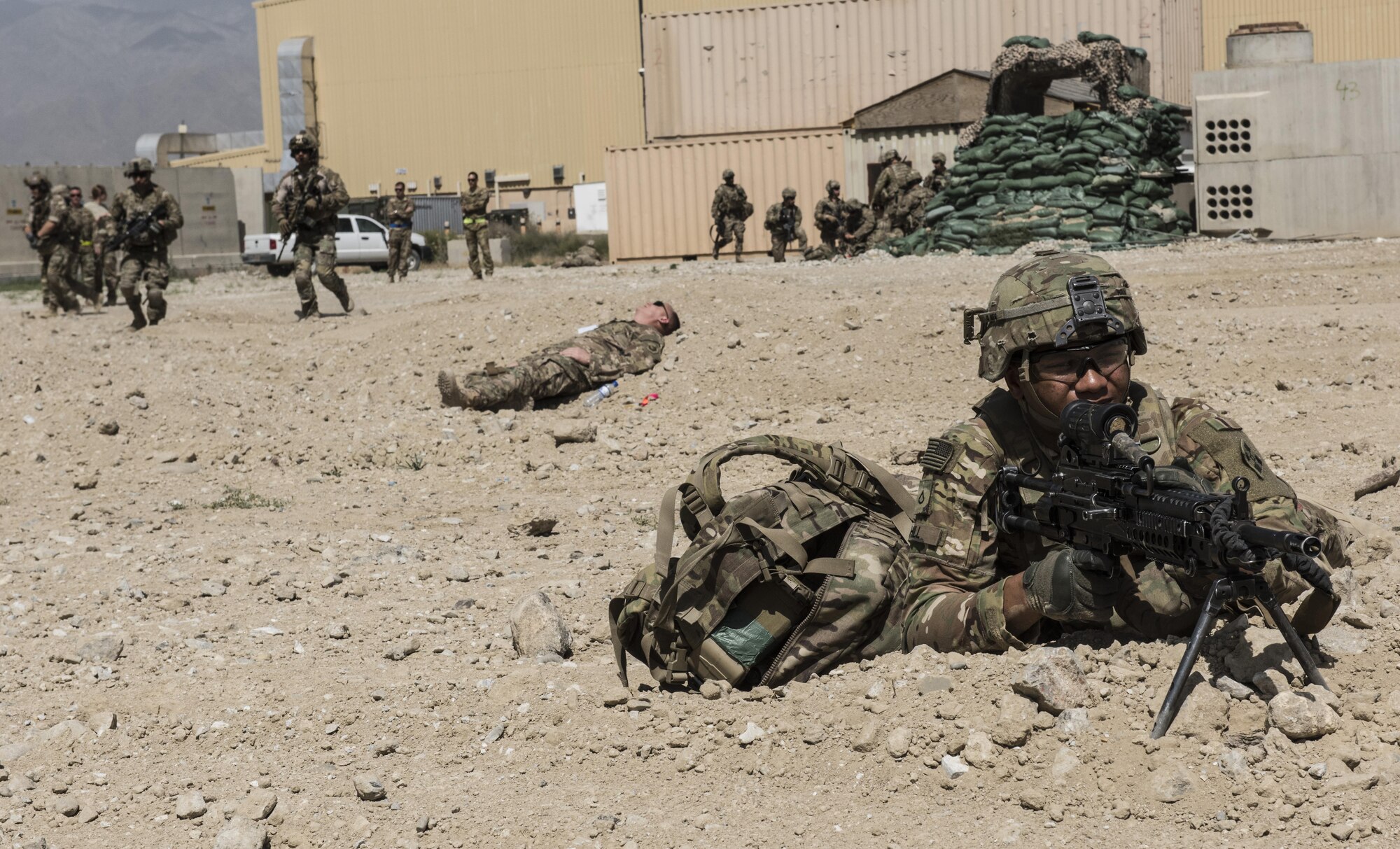 A U.S. Army soldier guards the perimeter during a mass casualty and extraction exercise with Airmen from the 83rd Expeditionary Rescue Squadron, June 16, 2016 at Bagram Airfield, Afghanistan. Patrol teams provide 360 degree security to combat enemy forces and ensure rescue and extraction teams can attend to the wounded and get them to a safe location. (U.S. Air Force photo by Tech. Sgt. Tyrona Lawson)