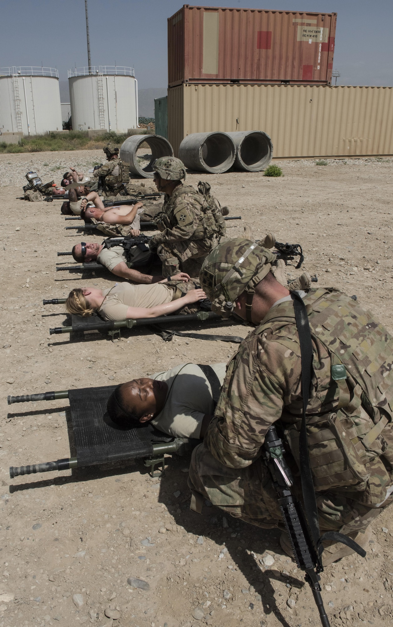 The 83rd Expeditionary Rescue Squadron pararescue specialists along with soldiers from Task Force Chosen work together to treat wounded patients during a joint mass casualty and extraction exercise, June 16, 2016 at Bagram Airfield, Afghanistan. Airmen from the 455th AEW acted as wounded patients, with injuries that included broken limbs, loss of eye sight and deliria. (U.S. Air Force photo by Tech. Sgt. Tyrona Lawson)