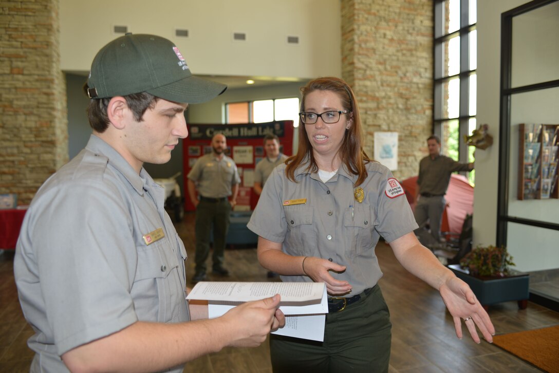 Sarah Peace, Nashville District park ranger from Center Hill Lake and training instructor helps Park Ranger Daniel Adams from Center Hill Lake during a boating safety exercise at the Cordell Hull Lake resource manager’s office in Cathage, Tenn., Jun. 3, 2016.  A group of U.S. Army Corps of Engineers Nashville District park rangers attended a water safety refresher class for new, summer hire and permanent rangers 

