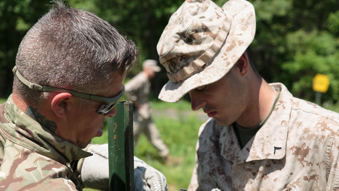 Pfc. Jacob D. Mays (right), a combat engineer with Company C, 6th Engineer Support Battalion, 4th Marine Logistics Group, Marine Forces Reserve, and Cpl. Sean P. Good (left), a communications corporal with 131 Commando Squadron Royal Engineers, British army, help build a defensive obstacle during exercise Red Dagger at Fort Indiantown Gap, Penn., June 13, 2016. Combat engineers enhance a force’s momentum by physically shaping the battle space to enhance a unit’s use of space and time while denying the enemy unencumbered movement. Exercise Red Dagger is a bilateral training exercise that gives Marines an opportunity to exchange tactics, techniques and procedures as well as build working relationships with their British counterparts. 