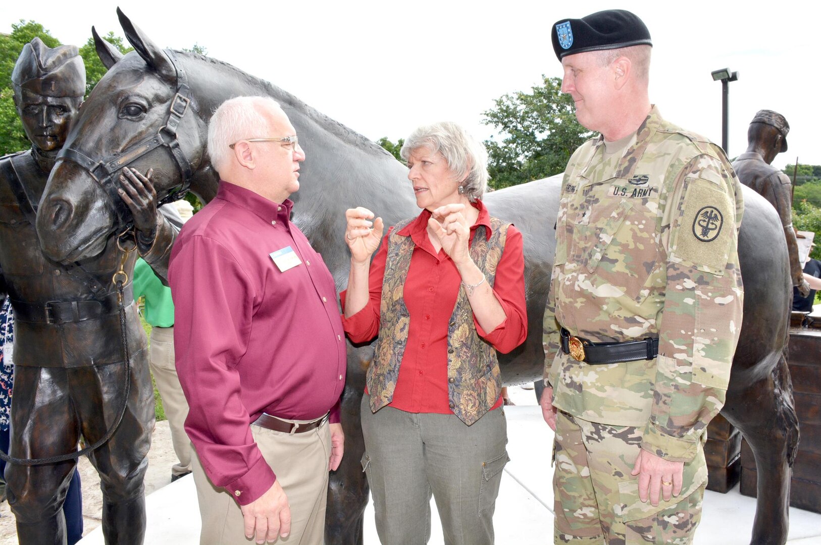 (From left) Dr. Joseph Kinnarney, Donna Dobberfuhl and Brig. Gen. Erik H. Torring talk in front of the new U.S. Army Veterinary Corps monument unveiled at the U.S. Army Medical Department Museum June 3 at Fort Sam Houston.
Kinnarney is the American Veterinary Medical Association president, Dobberfuhl is the local artist commissioned to create the sculpture and Torring is chief of the U.S. Army Veterinary Corps.