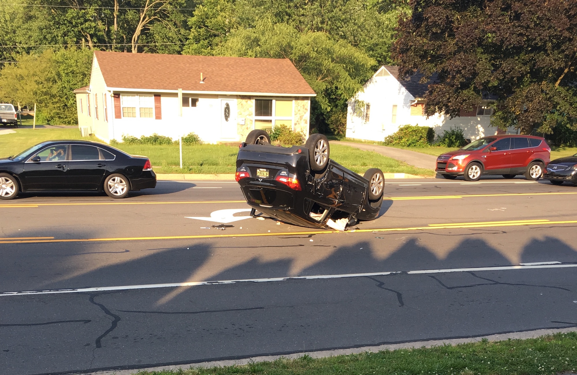 The aftermath of a car crash on June 11, 2016, Dover, Del. Staff Sgt. Lawrence Tungol, 512th Maintenance Squadron, and Senior Airmen Travis Beebe, 512th Memorial Affairs Squadron, were the first people on the scene to assist the driver and call 911. (U.S. Air Force Photo/ Staff Sgt. Lawrence Tungol)