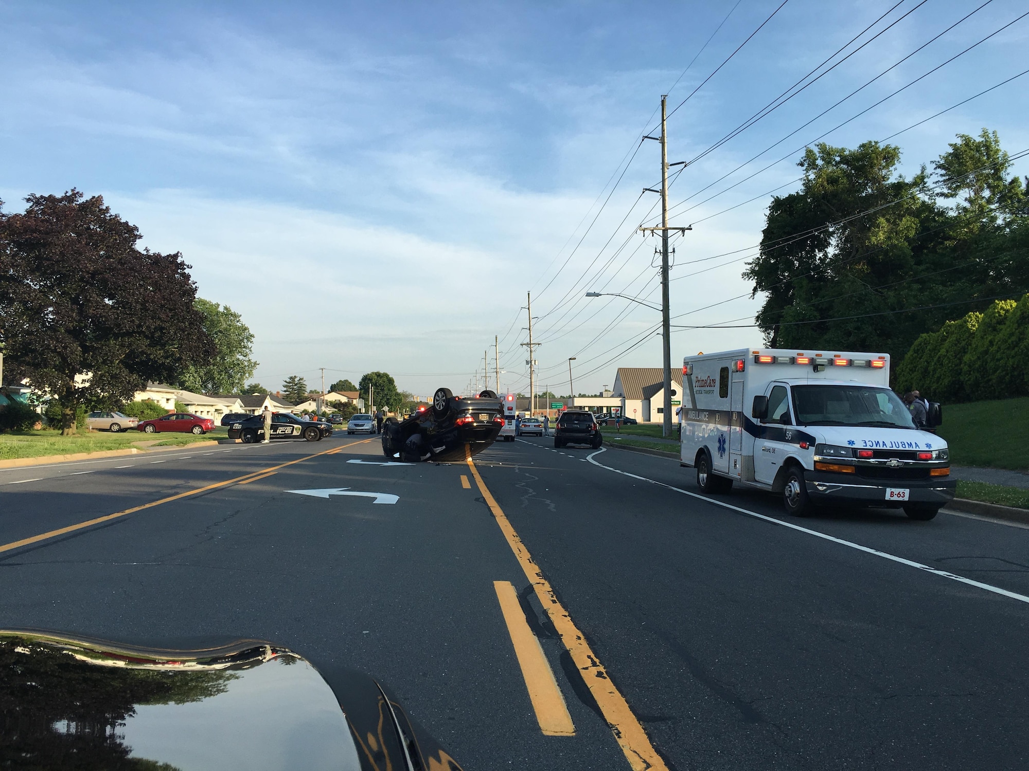 The aftermath of a car crash on June 11, 2016, Dover, Del. Staff Sgt. Lawrence Tungol, 512th Maintenance Squadron, and Senior Airmen Travis Beebe, 512th Memorial Affairs Squadron, were the first people on the scene to assist the driver and call 911. (U.S. Air Force Photo/ Senior Airman Travis Beebe)