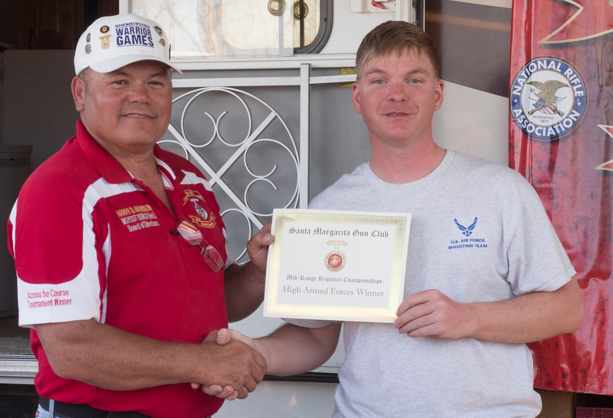 Harry D. Harrison, director of the National Rifle Association Mid-Range Regional Championship, presents Staff Sgt. Cameron Keating the High Armed Forces Winner award. The match was held May 21-22 at the Santa Margarita Gun Club at Marine Corps Base Camp Pendleton, California. (Photo courtesy Jonathan Ocab)