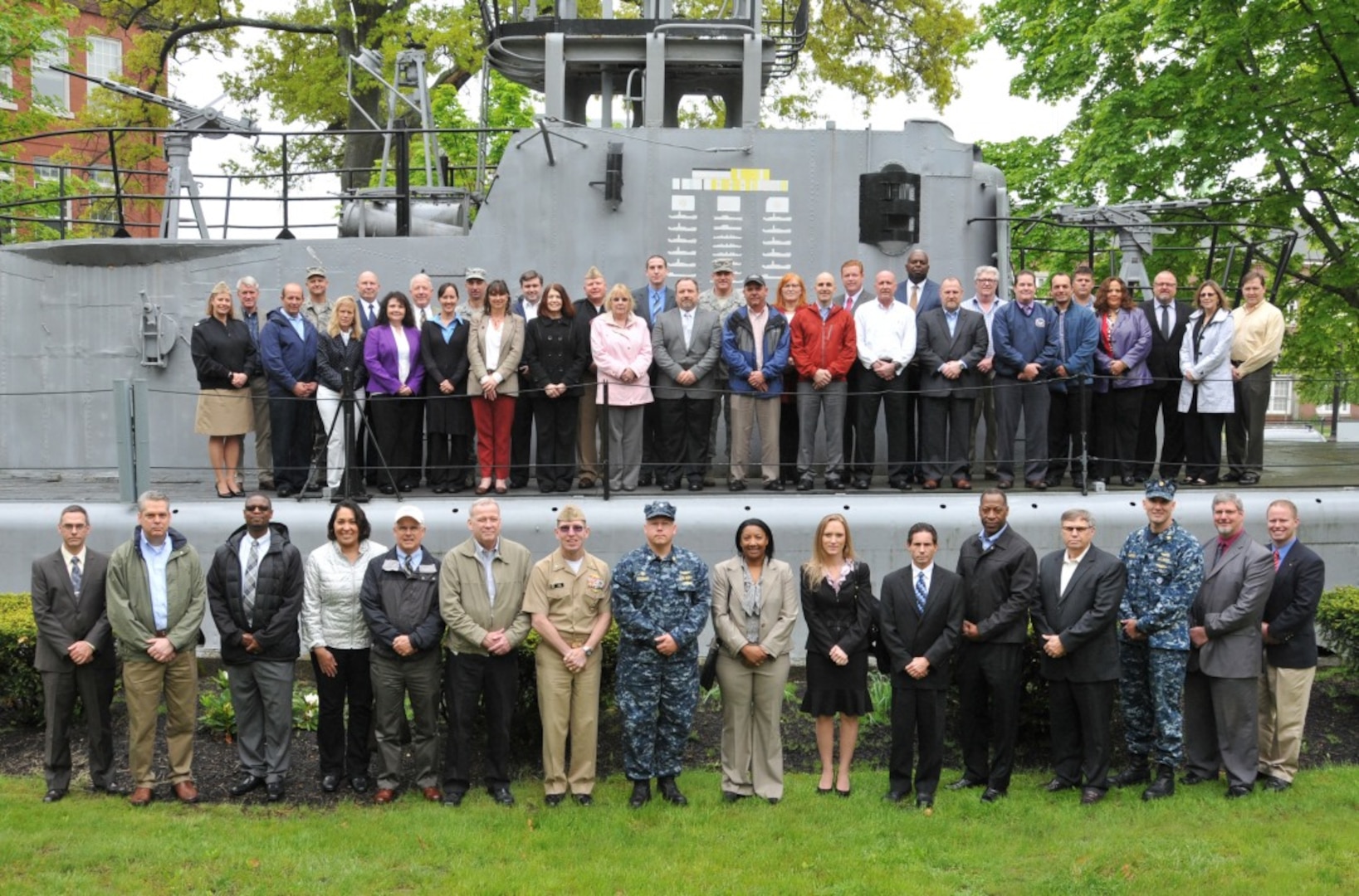 Photo caption: Participants in the DLA Semi-Annual Total Retail Sustainment Review gather at the mast of the USS Sailfish (formerly USS Squalus) at the Portsmouth Naval Shipyard in New Hampshire, May 24. (Photo by James Cleveland)