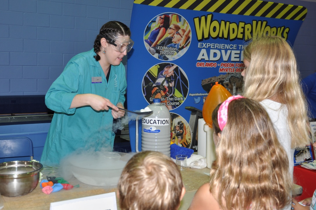 Emily Hill, Orlando Science Center Education Team, teaches children about the states of matter by using marshmallows and liquid nitrogen during the 45th Space Wing’s All SySTEMs Go event June 11, 2016, at the Youth Center/Shark Center at Patrick Air Force Base, Fla. The event was designed to teach children of all ages about science, technology, engineering and math. (U.S. Air Force Photo/Tech. Sgt. Erin Smith/Released)