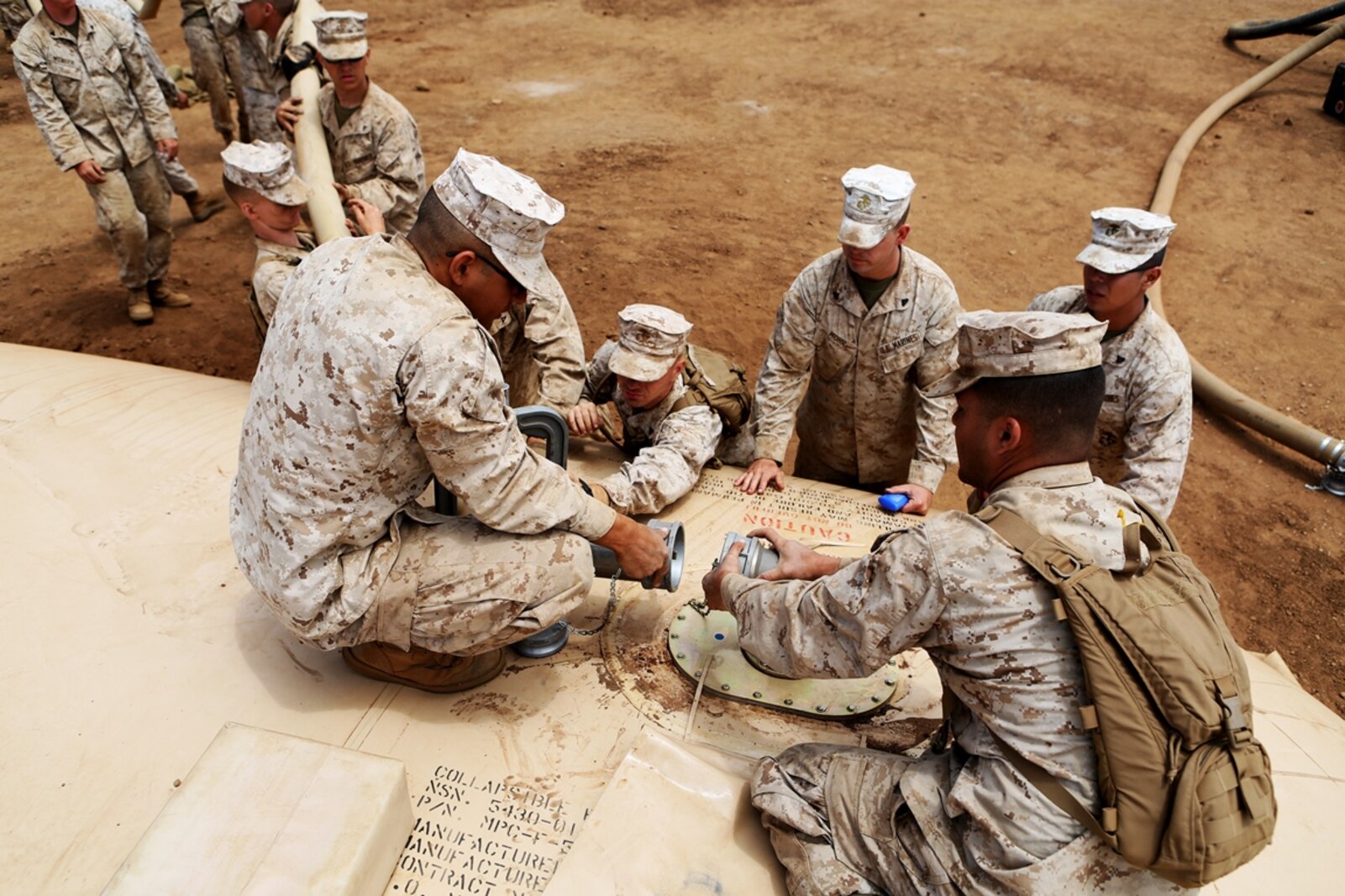 Bulk fuel and water purification Marines from 6th Engineer Support Battalion, 4th Marine Logistics Group, connect a hose to a 50,000 gallon bladder during an annual training exercise aboard Camp Pendleton, Calif., June 13, 2016 to increase readiness and fulfill their yearly requirements as a reserve unit. 7th ESB, 1st Marine Logistics Group, supported their reserve counterparts with the gear necessary to pump water nearly 3 miles from the ocean at Red Beach to a training area where they practiced setting up and maintaining massive stores of water. (U.S. Marine Corps photo by Sgt. Carson Gramley/released)