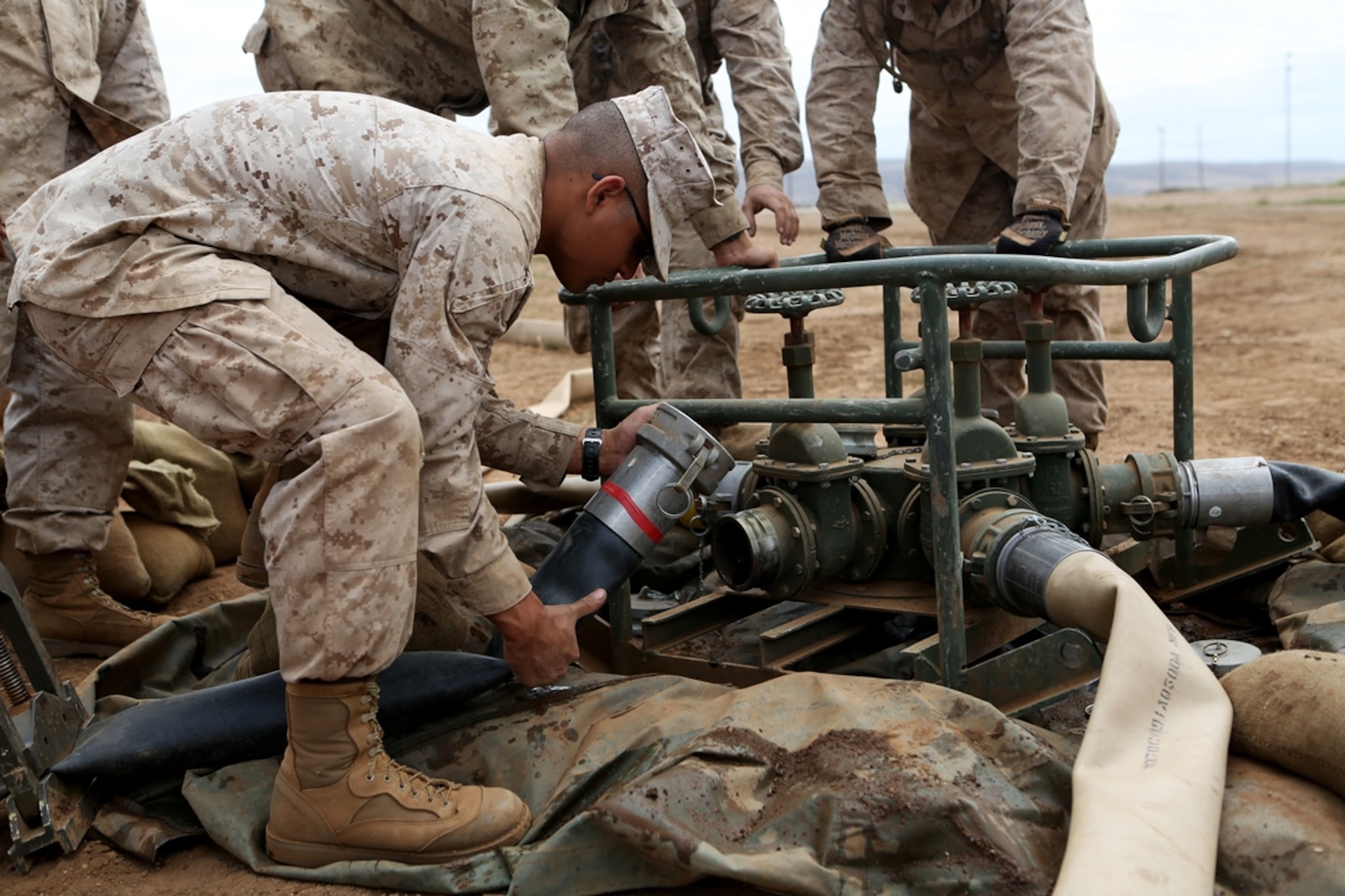 Bulk fuel and water purification Marines from 6th Engineer Support Battalion, 4th Marine Logistics Group, connect hoses to a spider manifold system during an annual training exercise aboard Camp Pendleton, Calif., June 13, 2016 to increase readiness and fulfill their yearly requirements as a reserve unit. 7th ESB, 1st Marine Logistics Group, supported their reserve counterparts with the gear necessary to pump water nearly 3 miles from the ocean at Red Beach to a training area where they practiced setting up and maintaining massive stores of water. (U.S. Marine Corps photo by Sgt. Carson Gramley/released)