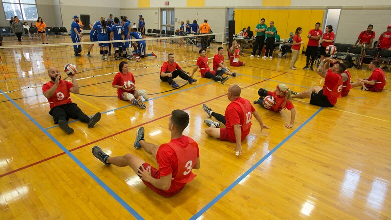 Members of Team Marine Corps practice setting during a 2016 Department of Defense (DoD) Warrior Games sitting volleyball warmup at the U.S. Military Academy at West Point, N.Y., June 13, 2016. The 2016 DoD Warrior Games is an adaptive sports competition for wounded, ill and injured Service members and veterans from the U.S. Army, Marine Corps, Navy, Air Force, Special Operations Command and the British Armed Forces. 