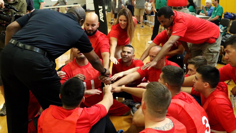 Members of Team Marine Corps bring it in with Sgt. Major of the Marine Corps Ronald L. Green, far left, prior to participating in sitting volleyball at the 2016 Department of Defense Warrior Games at West Point, N.Y., June 15, 2016.  The Warrior Games is an adaptive sports competition for wounded, ill and injured Service members and veterans from the U.S. Army, Marine Corps, Navy, Air Force, Special Operations Command and the British Armed Forces. 