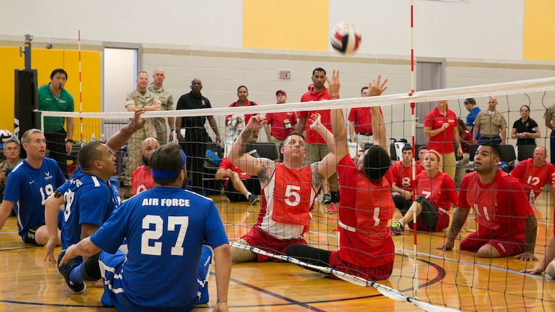 U.S. Marine Corps Staff Sgt. Brandon Dodson, number 5, prepares to spike the ball during a 2016 Department of Defense (DoD) Warrior Games sitting volleyball match at the U.S. Military Academy at West Point, N.Y., June 13, 2016. Dodson, a Lemoore, Calif., native, is a member of the 2016 DoD Warrior Games Team Marine Corps. The 2016 DoD Warrior Games is an adaptive sports competition for wounded, ill and injured Service members and veterans from the U.S. Army, Marine Corps, Navy, Air Force, Special Operations Command and the British Armed Forces. 