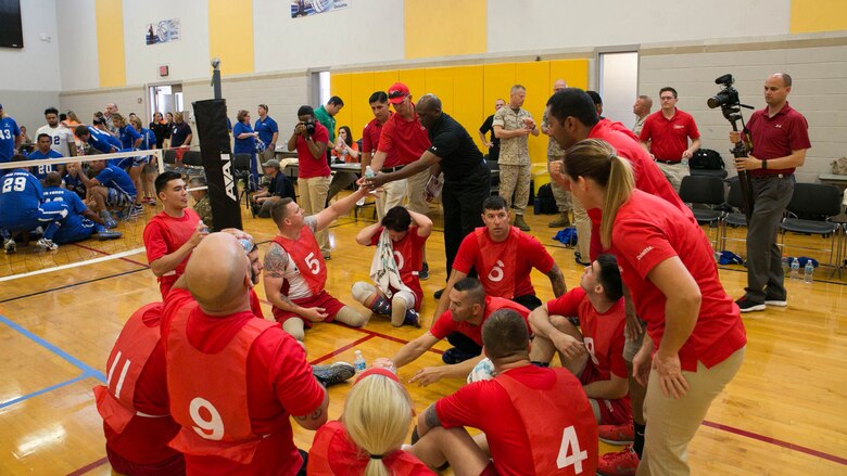 Sgt. Maj. of the Marine Corps Ronald L. Green hands out water and towels to members of Team Marine Corps during a 2016 Department of Defense (DoD) Warrior Games sitting volleyball match at the U.S. Military Academy at West Point, N.Y., June 13, 2016. The 2016 DoD Warrior Games is an adaptive sports competition for wounded, ill and injured Service members and veterans from the U.S. Army, Marine Corps, Navy, Air Force, Special Operations Command and the British Armed Forces. 