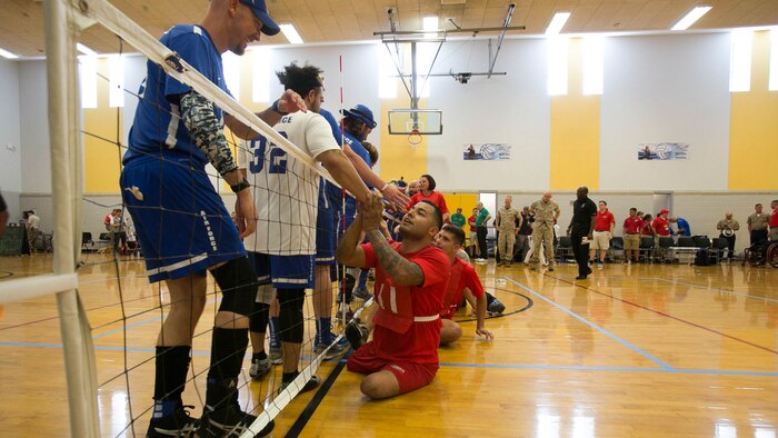 U.S. Marine Corps veteran Jorge Salazar shakes hands with a member of Team Air Force after a 2016 Department of Defense (DoD) Warrior Games sitting volleyball match at the U.S. Military Academy at West Point, N.Y., June 13, 2016. Salazar, a Delano, Calif., native, is a member of the 2016 DoD Warrior Games Team Marine Corps. The 2016 DoD Warrior Games is an adaptive sports competition for wounded, ill and injured Service members and veterans from the U.S. Army, Marine Corps, Navy, Air Force, Special Operations Command and the British Armed Forces. 