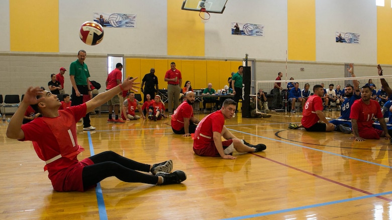 U.S. Marine Corps Lance Cpl. Robert Anfinson serves the ball during a 2016 Department of Defense (DoD) Warrior Games sitting volleyball match at the U.S. Military Academy at West Point, N.Y., June 13, 2016. Jimenez, a Plymouth, Mont., native, is a member of the 2016 DoD Warrior Games Team Marine Corps. The 2016 DoD Warrior Games is an adaptive sports competition for wounded, ill and injured Service members and veterans from the U.S. Army, Marine Corps, Navy, Air Force, Special Operations Command and the British Armed Forces. 