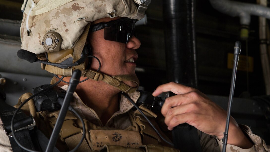 U.S. Marine Corps Staff Sgt. Steven Habon, platoon sergeant, Weapons Platoon, Fox Company, 2nd Battalion, 7th Marine Regiment, Special Purpose Marine Air-Ground Task Force-Crisis Response-Central Command 16.2, relays a command to his squad during Chemical, Biological, Radiological and Nuclear Defense Training at an undisclosed location in Southwest Asia, May 03, 2016. SPMAGTF-CR-CC is forward deployed in several host nations, with the ability to respond to a variety of contingencies rapidly and effectively. 