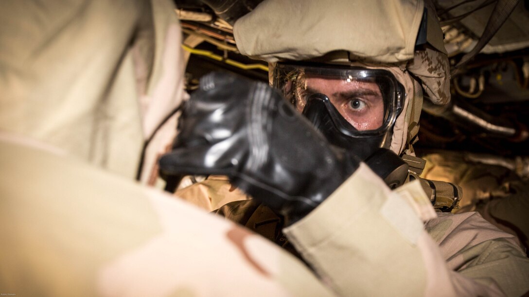 A U.S. Marine with Weapons Platoon, Fox Company, 2nd Battalion, 7th Marine Regiment, Special Purpose Marine Air-Ground Task Force-Crisis Response-Central Command 16.2, conducts Chemical, Biological, Radiological and Nuclear Defense Training at an undisclosed location in Southwest Asia, May 03, 2016. SPMAGTF-CR-CC is forward deployed in several host nations, with the ability to respond to a variety of contingencies rapidly and effectively. 