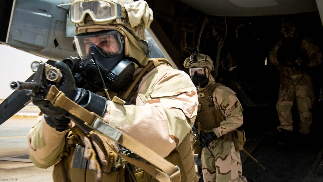 A U.S. Marine with Weapons Platoon, Fox Company, 2nd Battalion, 7th Marine Regiment, Special Purpose Marine Air-Ground Task Force-Crisis Response-Central Command 16.2, moves to a security position during Chemical, Biological, Radiological and Nuclear Defense Training at an undisclosed location in Southwest Asia, May 03, 2016. SPMAGTF-CR-CC is forward deployed in several host nations, with the ability to respond to a variety of contingencies rapidly and effectively. 