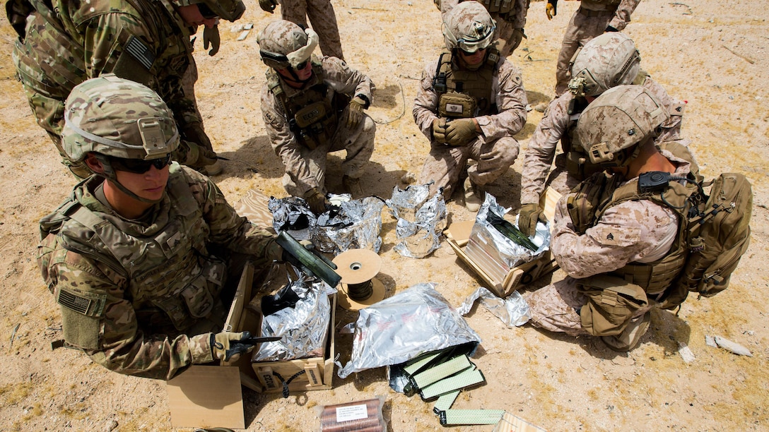 Explosive Ordnance Disposal Marines with Special Purpose Marine Air Ground Task Force - Crisis Response - Central Command 16.2, Soldiers with the 797th Ordnance Co., 79th Ordnance Bn., and Airmen with the 332nd Expeditionary Civil Engineer Squadron and the 386th ECES, perform combined explosive effects training at an undisclosed location in Southwest Asia, May 10, 2016. SPMAGTF-CR-CC is forward deployed in several host nations, with the ability to respond to a variety of contingencies rapidly and effectively. 