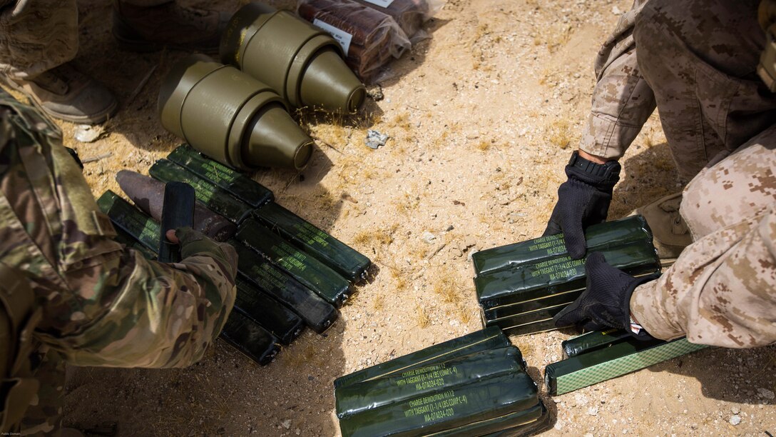 Explosive Ordnance Disposal Marines with Special Purpose Marine Air Ground Task Force - Crisis Response - Central Command 16.2, Soldiers with the 797th Ordnance Co., 79th Ordnance Bn., and Airmen with the 332nd Expeditionary Civil Engineer Squadron and the 386th ECES, perform combined explosive effects training at an undisclosed location in Southwest Asia, May 10, 2016. SPMAGTF-CR-CC is forward deployed in several host nations, with the ability to respond to a variety of contingencies rapidly and effectively. 