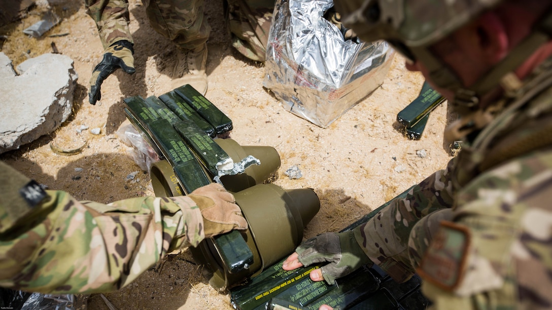 Explosive Ordnance Disposal Marines with Special Purpose Marine Air Ground Task Force - Crisis Response - Central Command 16.2, Soldiers with the 797th Ordnance Co., 79th Ordnance Bn., and Airmen with the 332nd Expeditionary Civil Engineer Squadron and the 386th ECES, perform combined explosive effects training at an undisclosed location in Southwest Asia, May 10, 2016. SPMAGTF-CR-CC is forward deployed in several host nations, with the ability to respond to a variety of contingencies rapidly and effectively. 