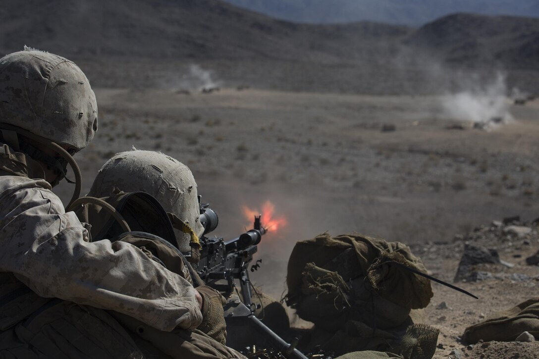 Reserve Marines with 1st Battalion, 24th Marines, 25th Marine Regiment, 4th Marine Division, Marine Forces Reserve, provide suppressive machine gun fire for ground units at range 410A during Integrated Training Exercise 4-16, at Marine Corps Air Ground Combat Center Twentynine Palms, Calif., June 14, 2016. ITX 4-16 allows Reserve Marines to train in realistic environments to increase their proficiency and readiness for worldwide deployment. (U.S. Marine Corps photo by Sgt. Sara Graham)
