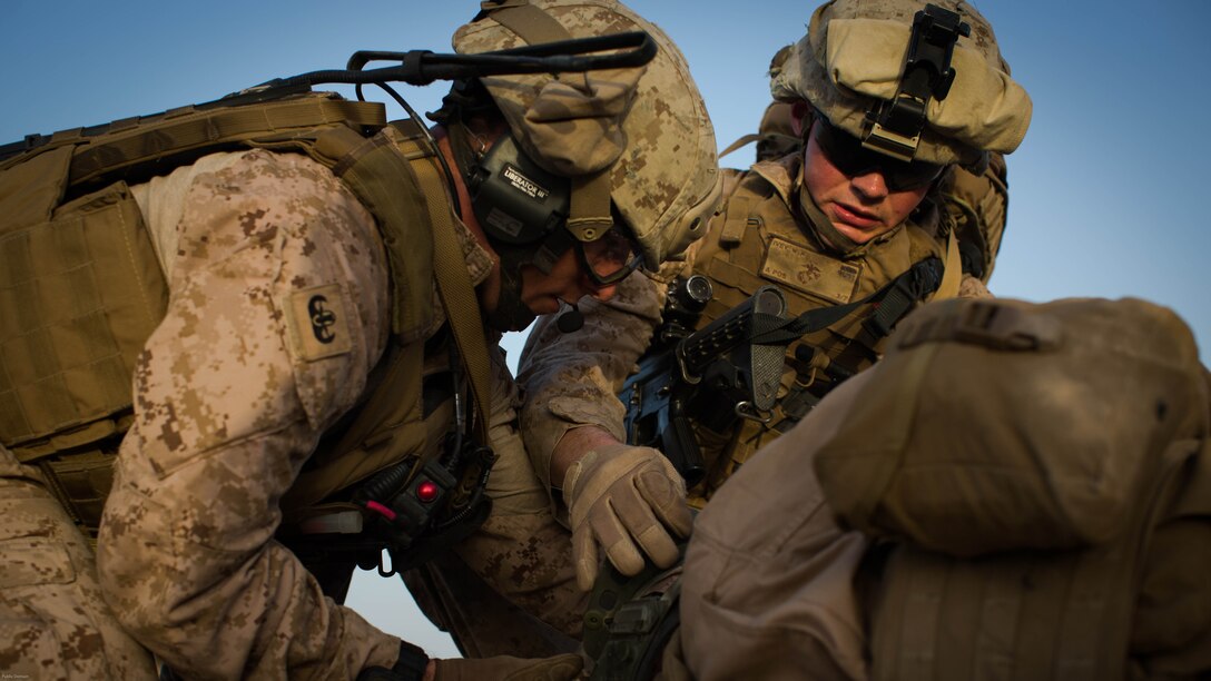 U.S. Marines with 2nd Battalion, 7th Marine Regiment, Special Purpose Marine Air Ground Task Force - Crisis Response - Central Command, put a neck brace on a simulated casualty during a Tactical Recovery of Aircraft and Personnel exercise at an undisclosed location in Southwest Asia, May 23, 2016. SPMAGTF-CR-CC is ready to respond to any crisis response mission in theater to include the employment of a TRAP force. 
