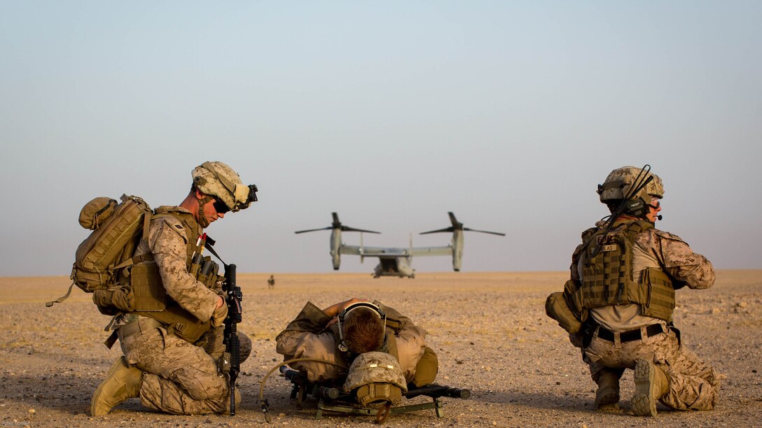 U.S. Marines with 2nd Battalion, 7th Marine Regiment, Special Purpose Marine Air Ground Task Force - Crisis Response - Central Command, provide security before moving a simulated casualty during a Tactical Recovery of Aircraft and Personnel exercise at an undisclosed location in Southwest Asia, May 23, 2016. SPMAGTF-CR-CC is ready to respond to any crisis response mission in theater to include the employment of a TRAP force. 