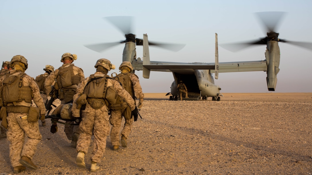 U.S. Marines with 2nd Battalion, 7th Marine Regiment, Special Purpose Marine Air Ground Task Force - Crisis Response - Central Command, carry a simulated casualty to an MV-22 Osprey during a Tactical Recovery of Aircraft and Personnel exercise at an undisclosed location in Southwest Asia, May 23, 2016. SPMAGTF-CR-CC is ready to respond to any crisis response mission in theater to include the employment of a TRAP force. 