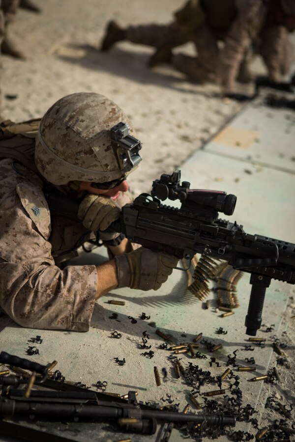 U.S. Marine Corps Sgt. Zachary Runge, a squad leader with Company C, Marine Wing Support Squadron 373, Special Purpose Marine Air Ground Task Force - Crisis Response - Central Command 16.2, fires an M249 light machine gun during a familiarization range at an undisclosed location in Southwest Asia, June 8, 2016. SPMAGTF-CR-CC is forward deployed in several host nations, with the ability to respond to a variety of contingencies rapidly and effectively. 