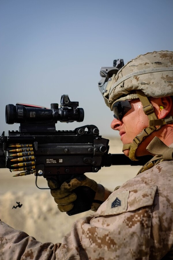 U.S. Marine Corps Sgt. Zachary Runge, a squad leader with Company C, Marine Wing Support Squadron 373, Special Purpose Marine Air Ground Task Force - Crisis Response - Central Command 16.2, fires an M249 light machine gun from the standing position during a familiarization range at an undisclosed location in Southwest Asia, June 8, 2016. SPMAGTF-CR-CC is forward deployed in several host nations, with the ability to respond to a variety of contingencies rapidly and effectively. 