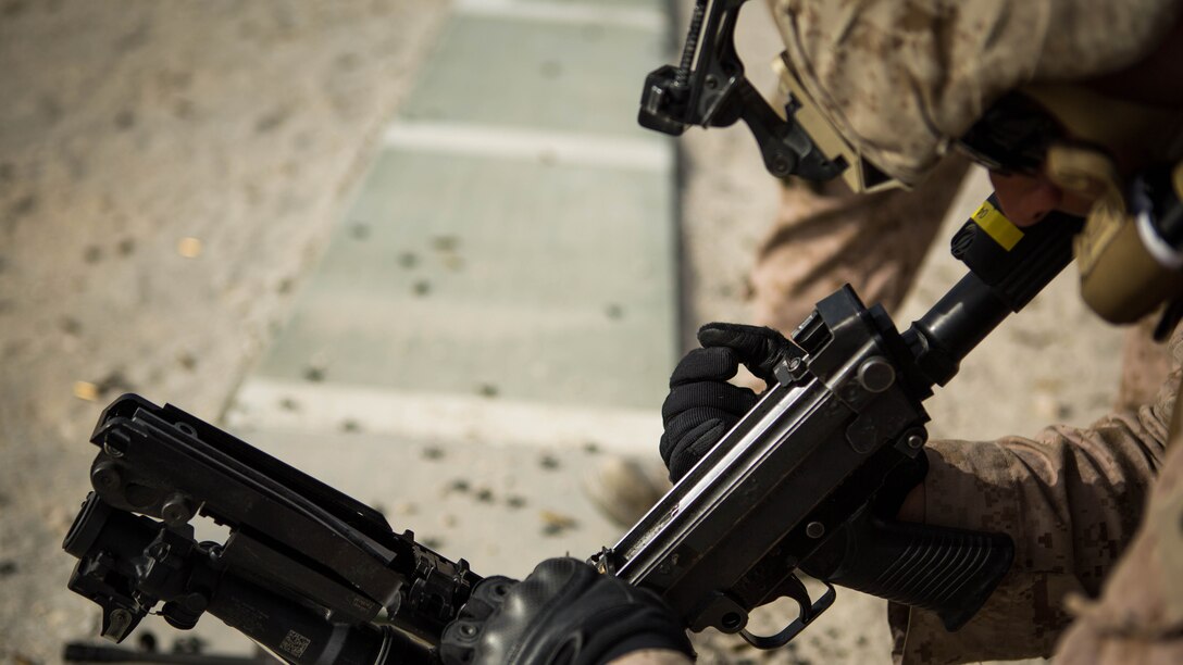 U.S. Marine Corps Cpl. Franklin Venturini, a fire team leader with Company C, Marine Wing Support Squadron 373, Special Purpose Marine Air Ground Task Force - Crisis Response - Central Command 16.2, performs remedial action on an M249 light machine gun during a familiarization range at an undisclosed location in Southwest Asia, June 8, 2016. SPMAGTF-CR-CC is forward deployed in several host nations, with the ability to respond to a variety of contingencies rapidly and effectively. 