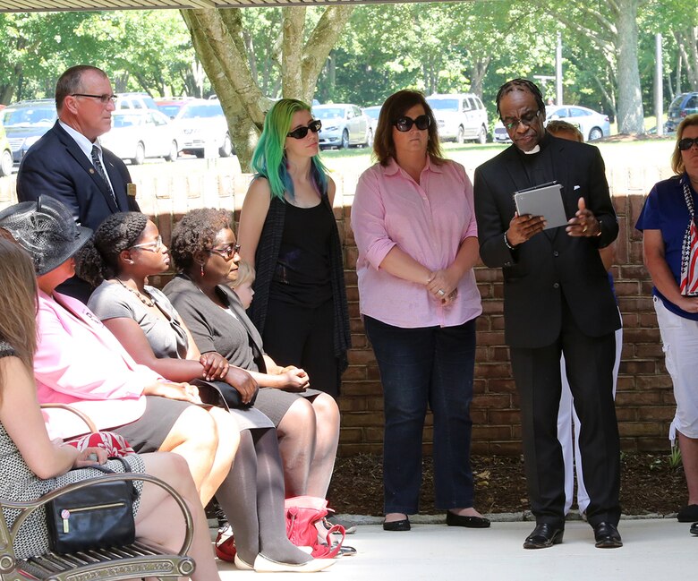 Dwight Micheal, a contracting officer for Combat Support Systems at Marine Corps Systems Command and pastor of Piney Branch Baptist Church in Spotsylvania, Virginia, delivers the eulogy at a funeral for World War II veteran Serina Vine June 7. Vine passed away May 21 with no known next of kin, and Micheal and two other MCSC employees came together to organize her funeral, complete with full military honors. More than 200 people attended the ceremony at Quantico National Cemetery in Triangle, Virginia, thanks to the efforts of the MCSC members. (U.S. Marine Corps photo by Mathuel Browne)