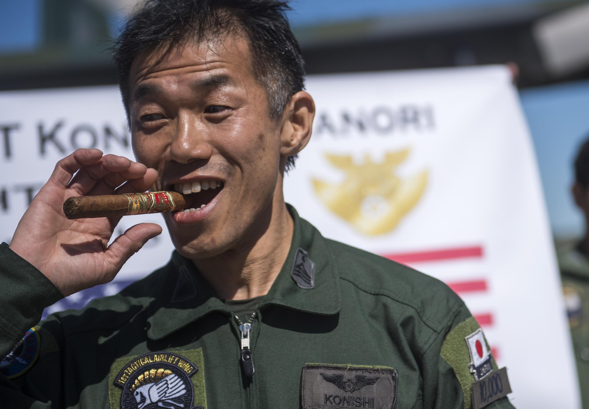 Japanese Air Self Defense Force Chief Master Sgt. Takanori Konishi, assigned to the 401st Squadron completes a milestone of 10,000 C-130 Hercules flight hours on Joint Base Elmendorf-Richardson, Alaska, June 15, 2016.(U.S. Air Force photo by Senior Airman James Richardson)