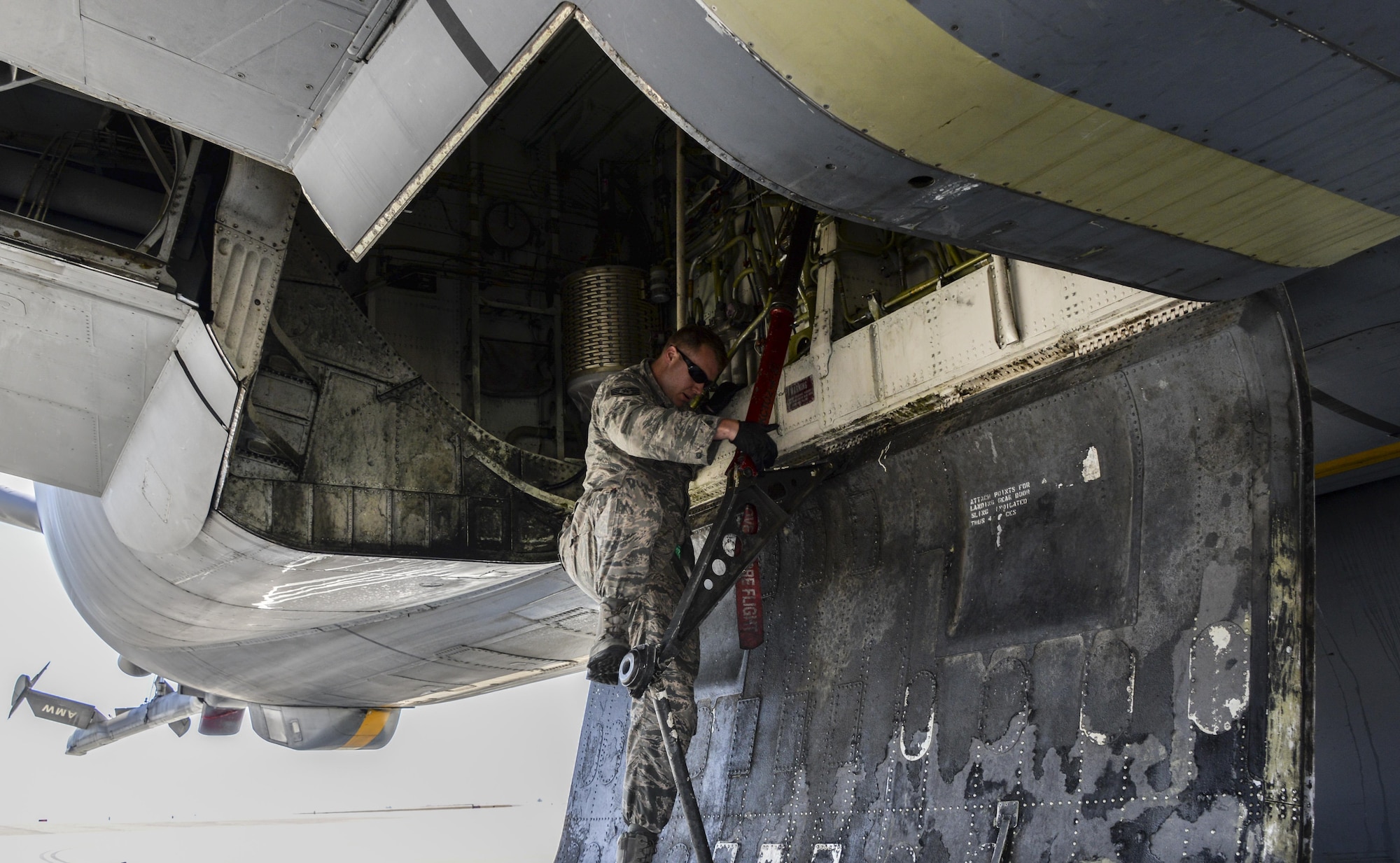 Staff Sgt. Jason Eickhoff, 60th Maintenance Squadron hydraulics technician, visually inspects a KC-10 Extender June 13 at Travis Air Force Base, Calif. Eickhoff, previously trained on the C-5M Super Galaxy, now has training on all three jets at Travis.  