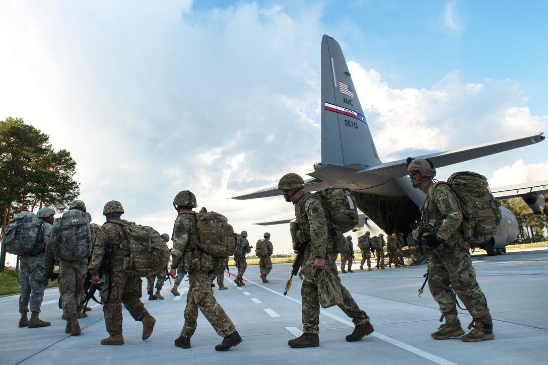 U.S. and British paratroopers board a C-130J Super Hercules aircraft during Exercise Swift Response 16 at the Bydgoszcz Airport, Poland, June 8, 2016. Air Force photo by Master Sgt. Joseph Swafford