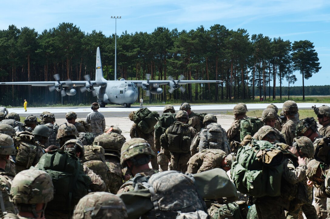 U.S. and British paratroopers prepare to board a C-130J Super Hercules aircraft during Exercise Swift Response 16 at the Bydgoszcz Airport, Poland, June 8, 2016. Air Force photo by Master Sgt. Joseph Swafford