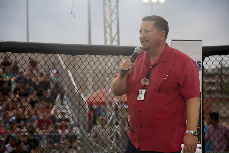 Brent Norquist, deputy assistant chief of staff, Marine Corps Community Services, speaks with the Marines before the bouts begin during the Mixed Marital Arts Fight Night Live at Del Valle Field aboard the Marine Corps Air Ground Combat Center, Twentynine Palms, Calif., June 10, 2016.  (U.S. Marine Corps photo by Lance Cpl. Devin Andrews/Released)